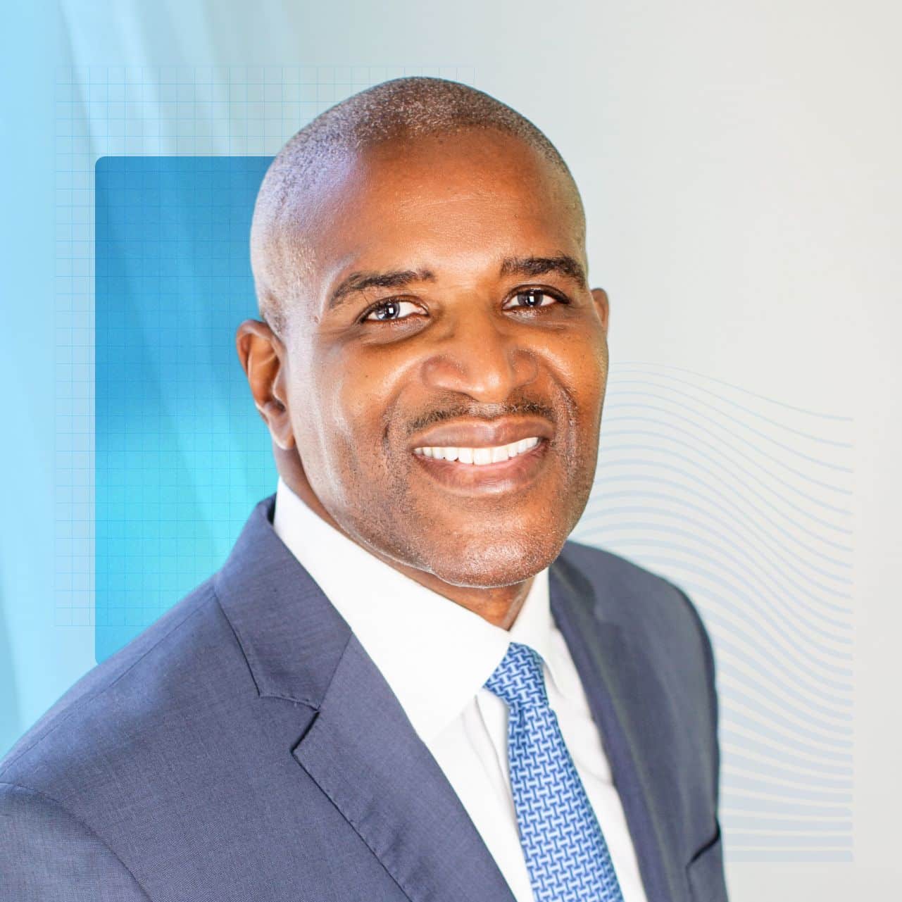 Kevin Brown of Dell Technologies in a blue suit and white button-down with a blue tie